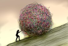 An illustration of a woman pushing a large, messy, tangled ball up a hill